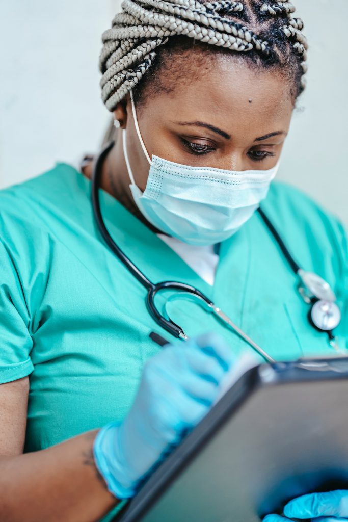 Nurse updating app on tablet